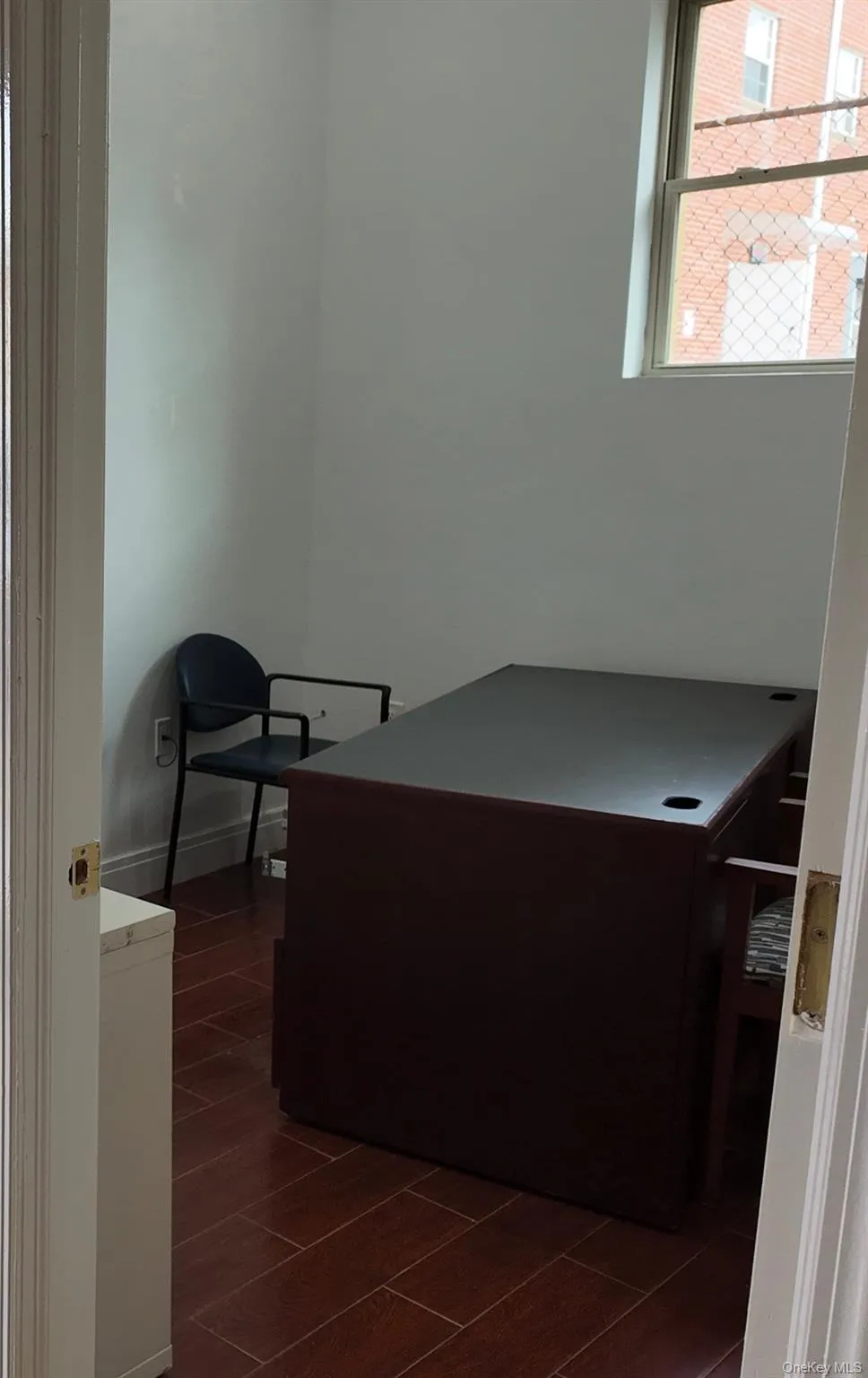 Home office featuring wood finish floors Home office featuring wood finish floors