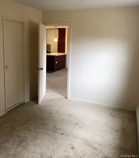 Spare room with light colored carpet Spare room with light colored carpet