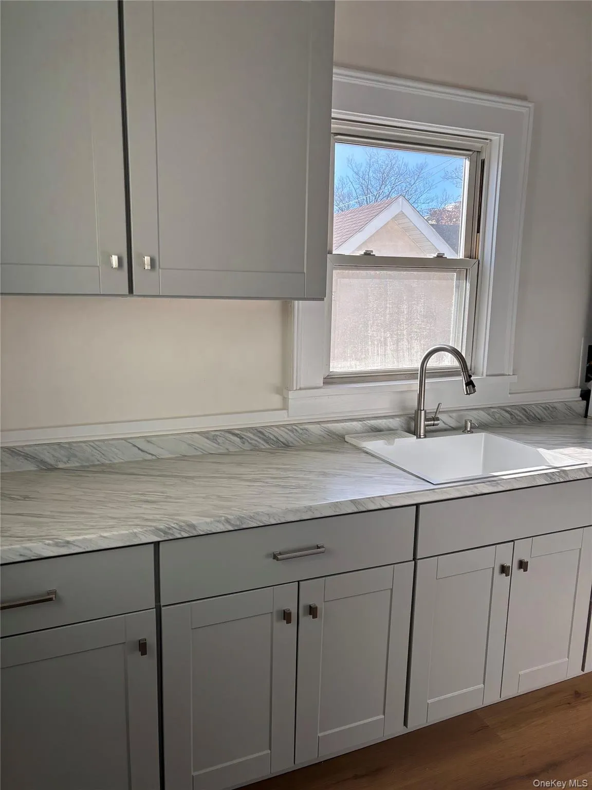 Galley Kitchen w/new cabinetry and new laminate floor Galley Kitchen w/new cabinetry and new laminate floor