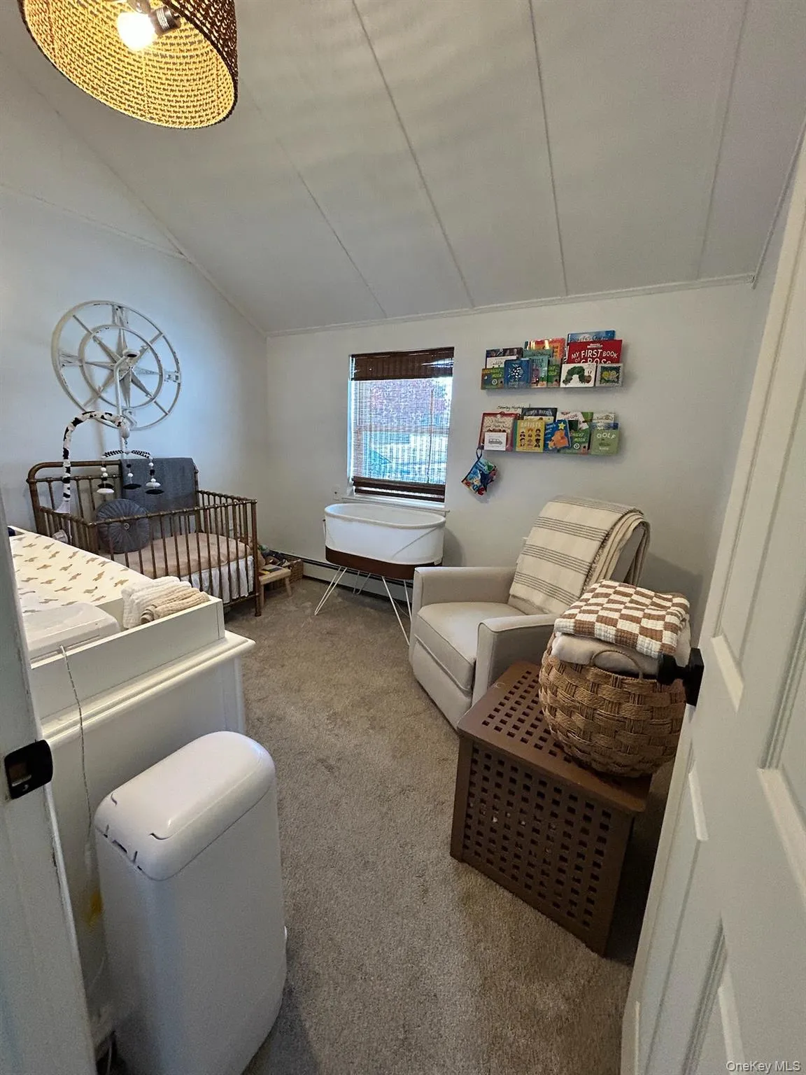 Living area with lofted ceiling and carpet flooring Living area with lofted ceiling and carpet flooring