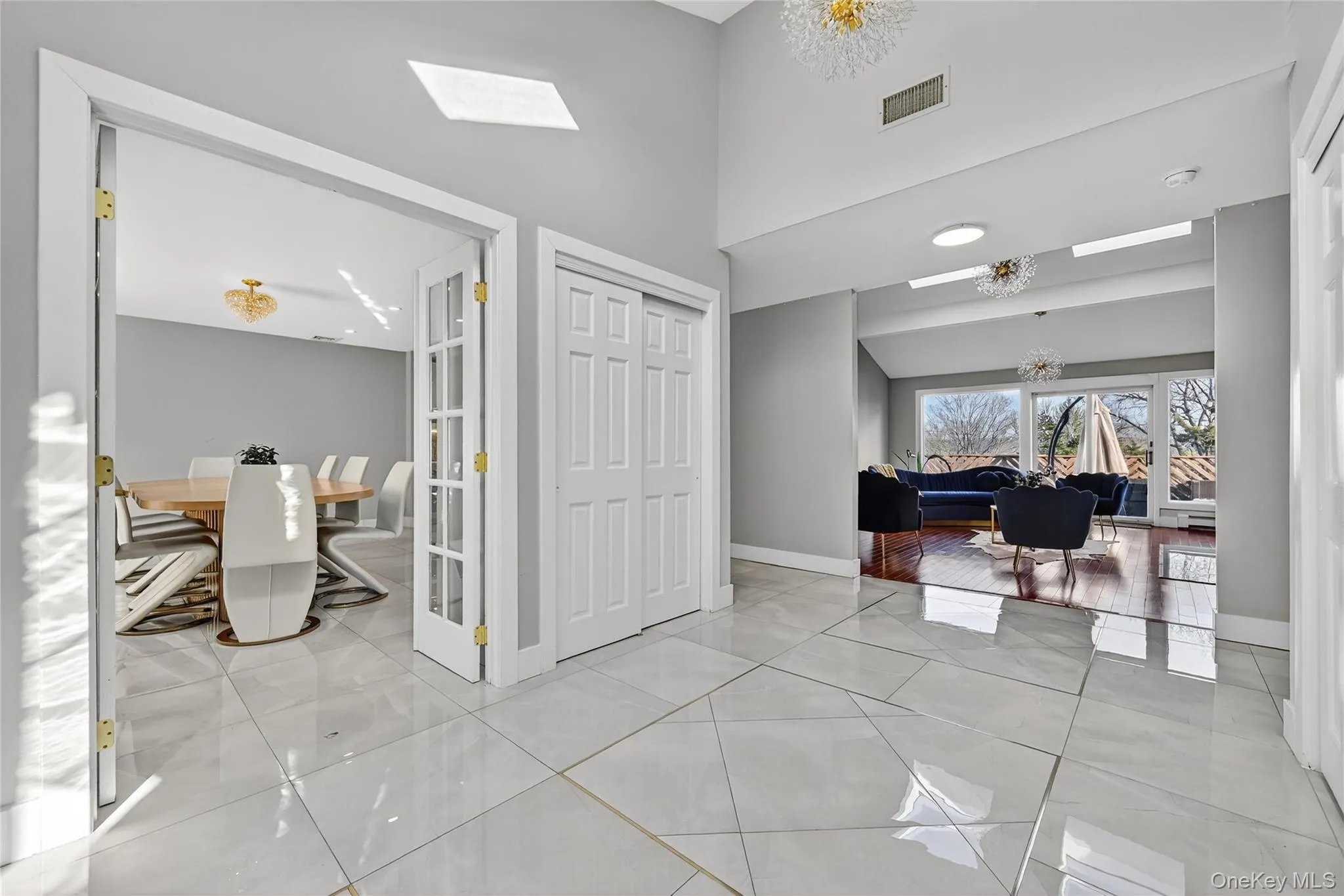 Entryway leading to Dining Room, Living Room and Den Entryway leading to Dining Room, Living Room and Den