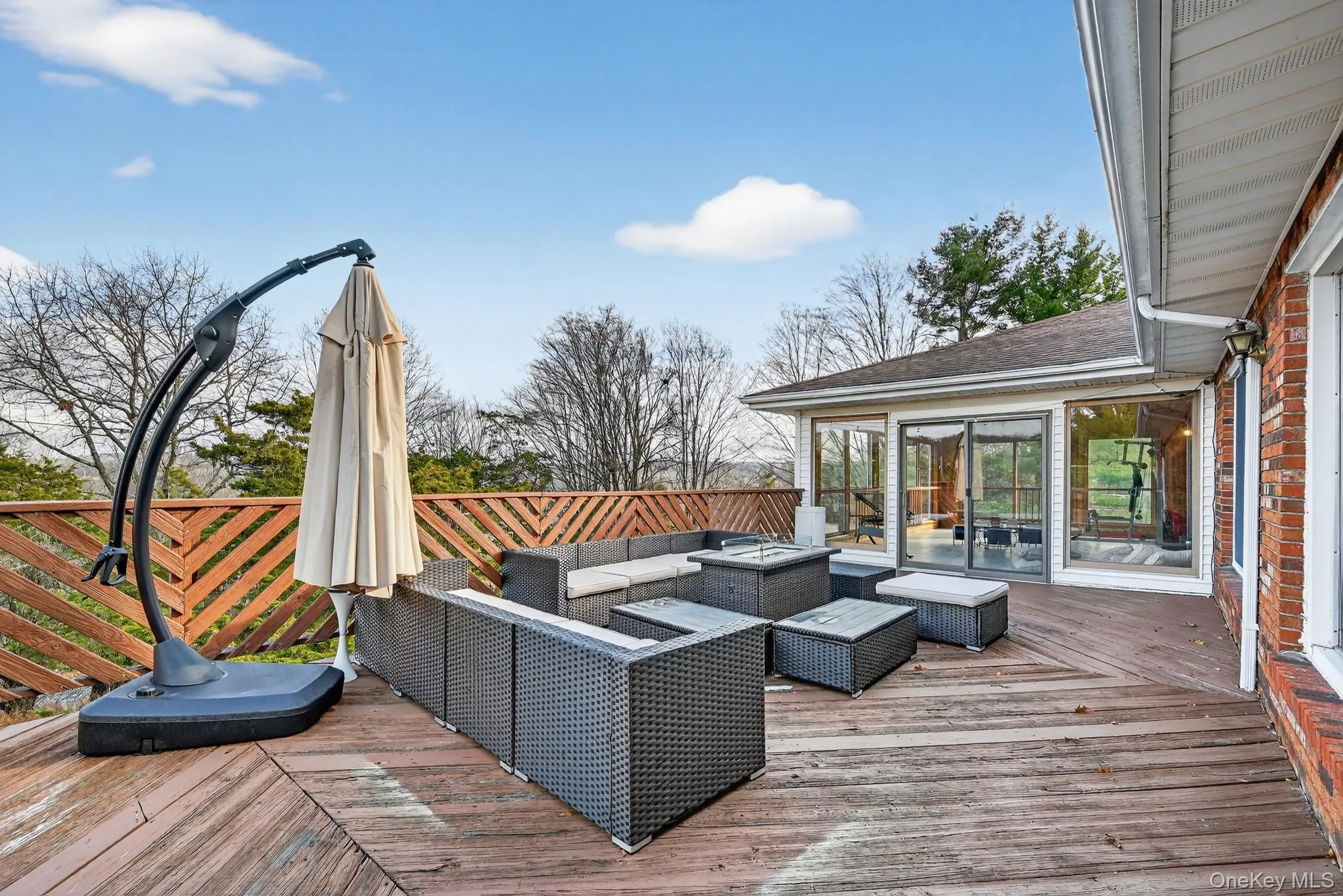 Large deck with outdoor seating and fire pit Large deck with outdoor seating and fire pit