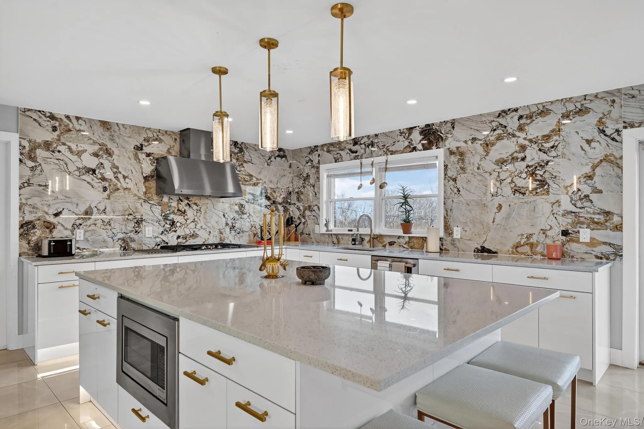 Renovated Kitchen with marble backsplash and smart appliances Renovated Kitchen with marble backsplash and smart appliances