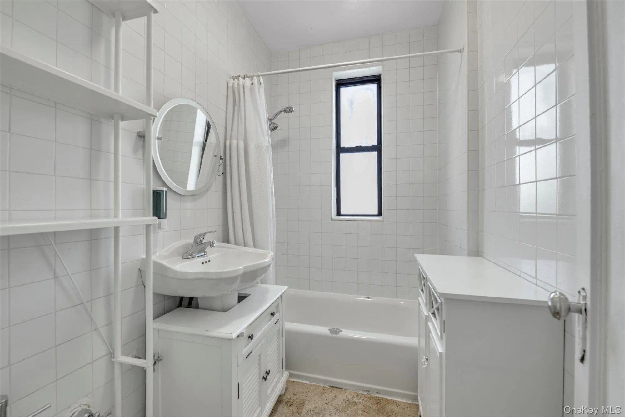 Full bath with shower / tub combo with curtain, tile walls, and vanity Full bath with shower / tub combo with curtain, tile walls, and vanity