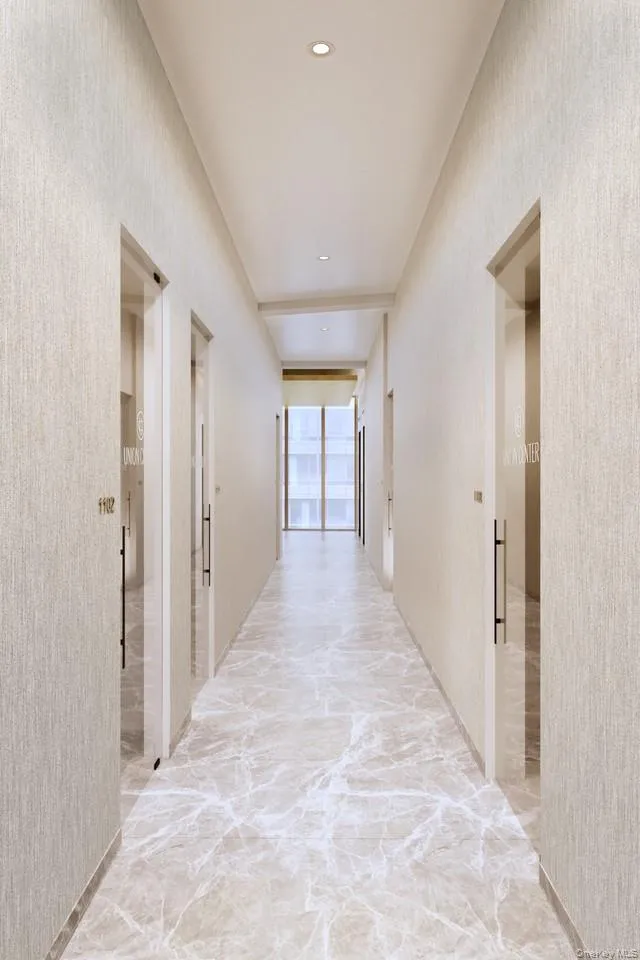 Hall featuring marble finish floor and recessed lighting Hall featuring marble finish floor and recessed lighting