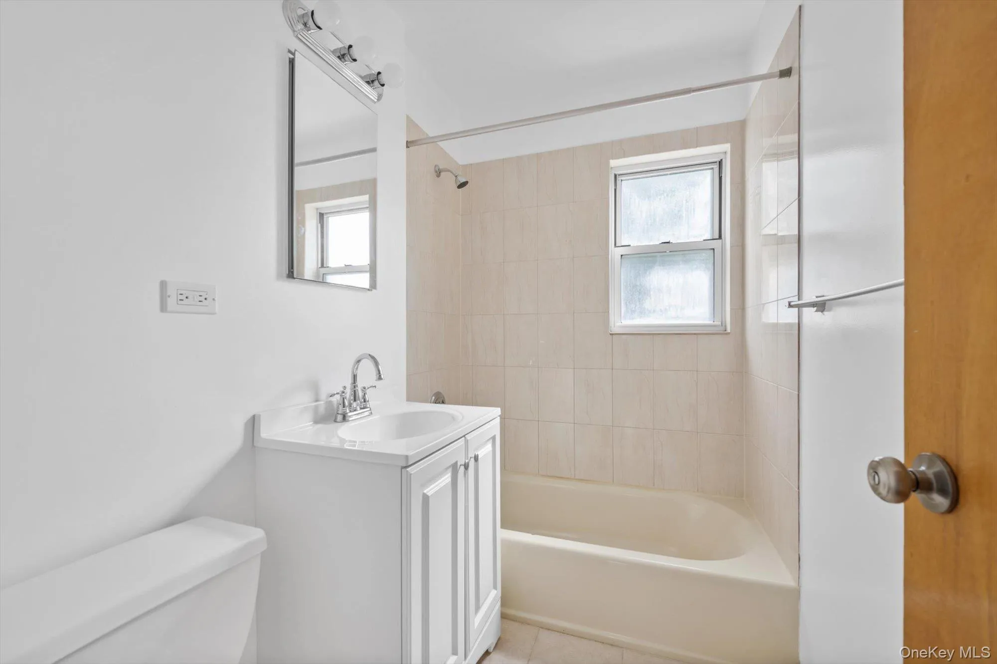 Full bathroom with vanity and tub / shower combination Full bathroom with vanity and tub / shower combination