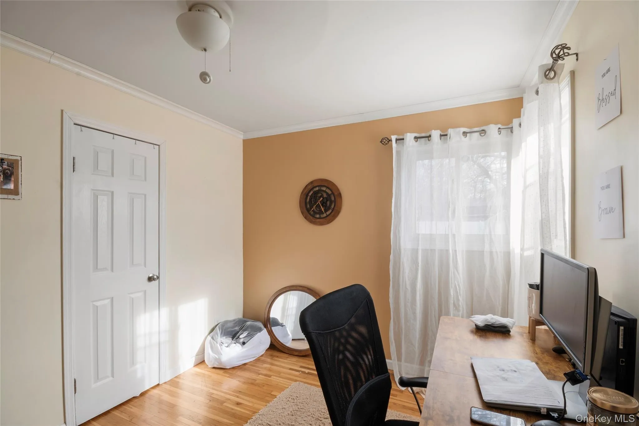 Office space featuring ornamental molding and wood finished floors Office space featuring ornamental molding and wood finished floors