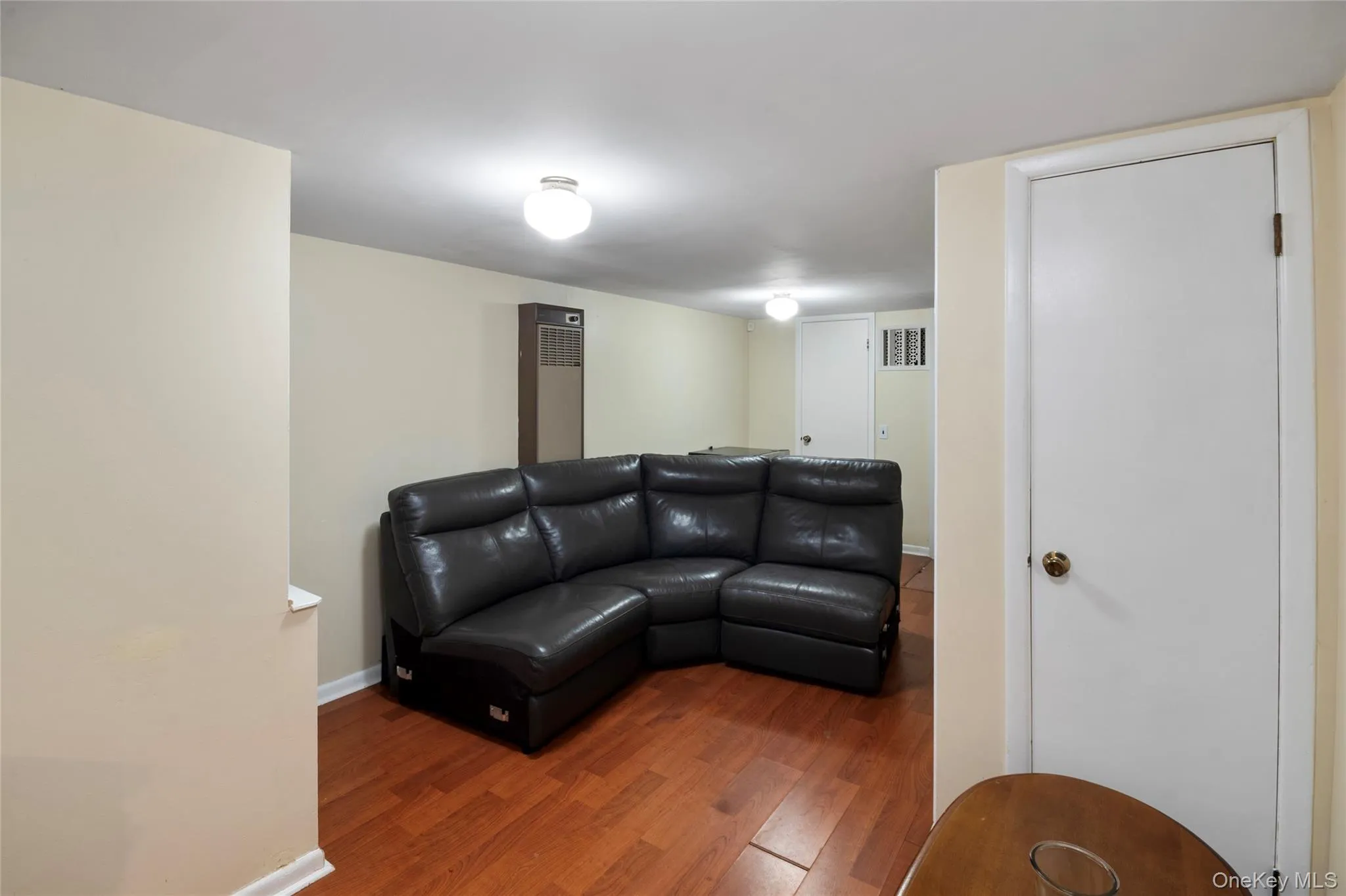 Living room with wood finished floors and baseboards Living room with wood finished floors and baseboards