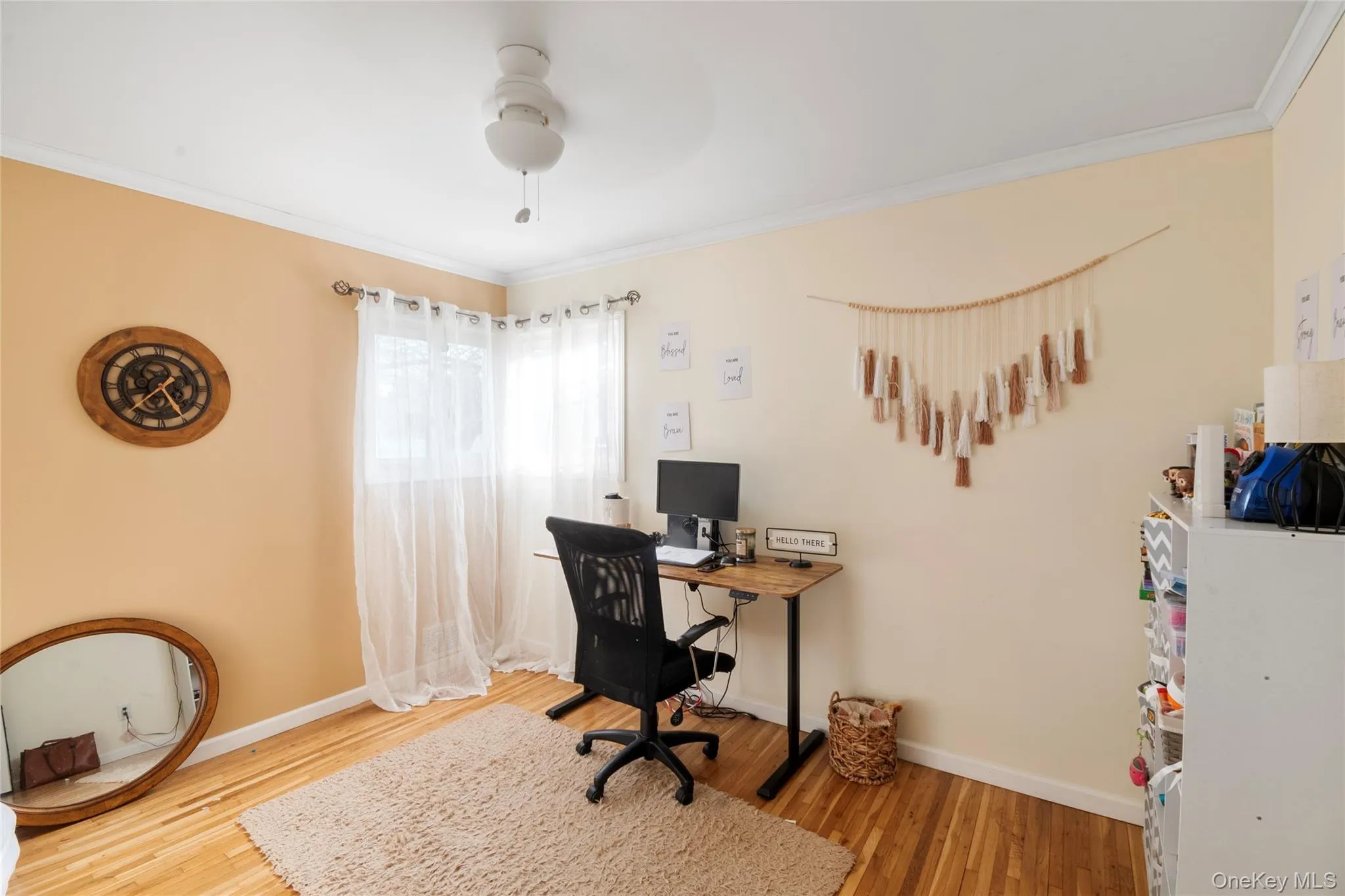 Office space featuring crown molding, light wood-type flooring, and ceiling fan Office space featuring crown molding, light wood-type flooring, and ceiling fan