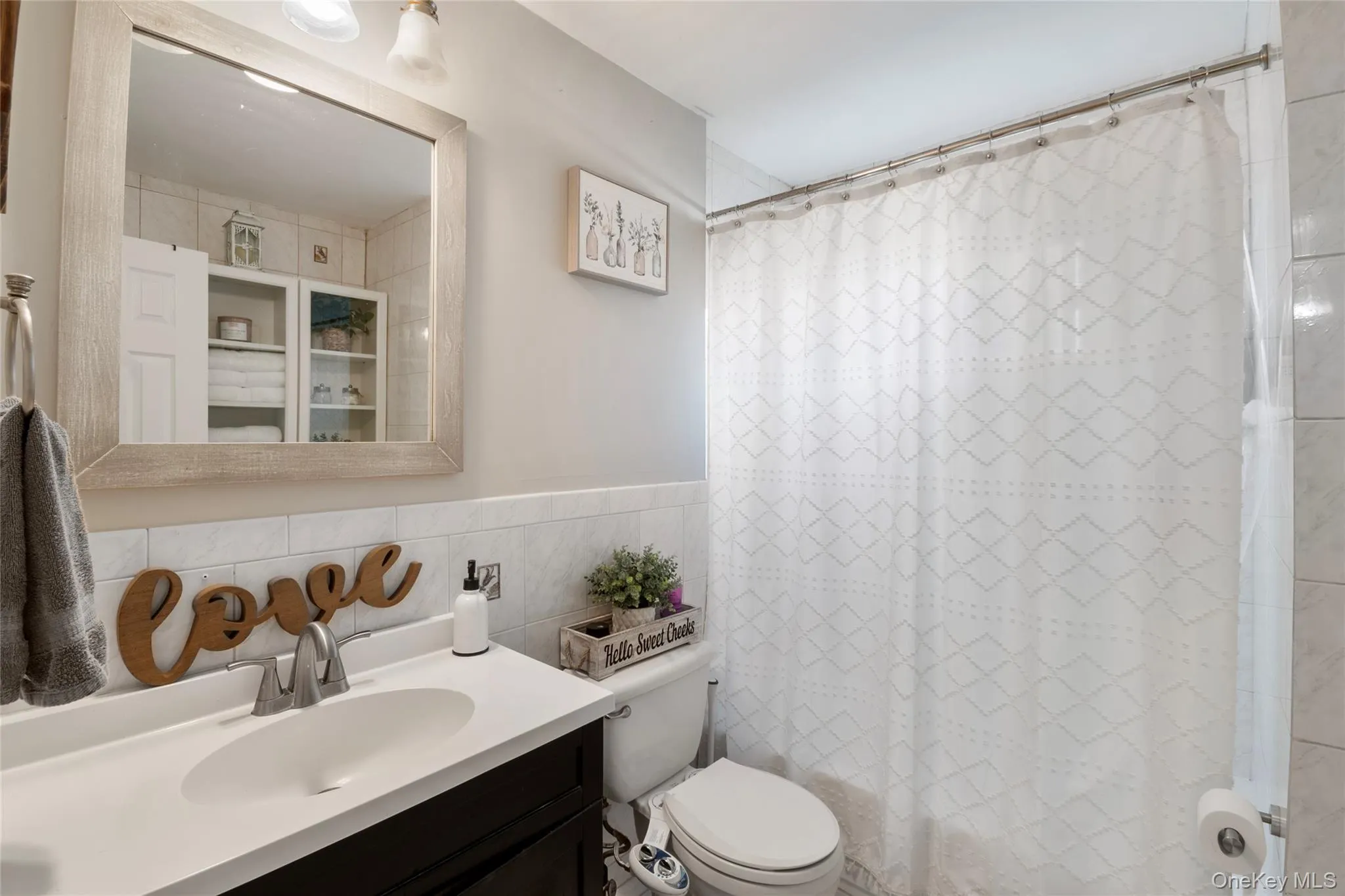 Bathroom with tile walls and vanity Bathroom with tile walls and vanity
