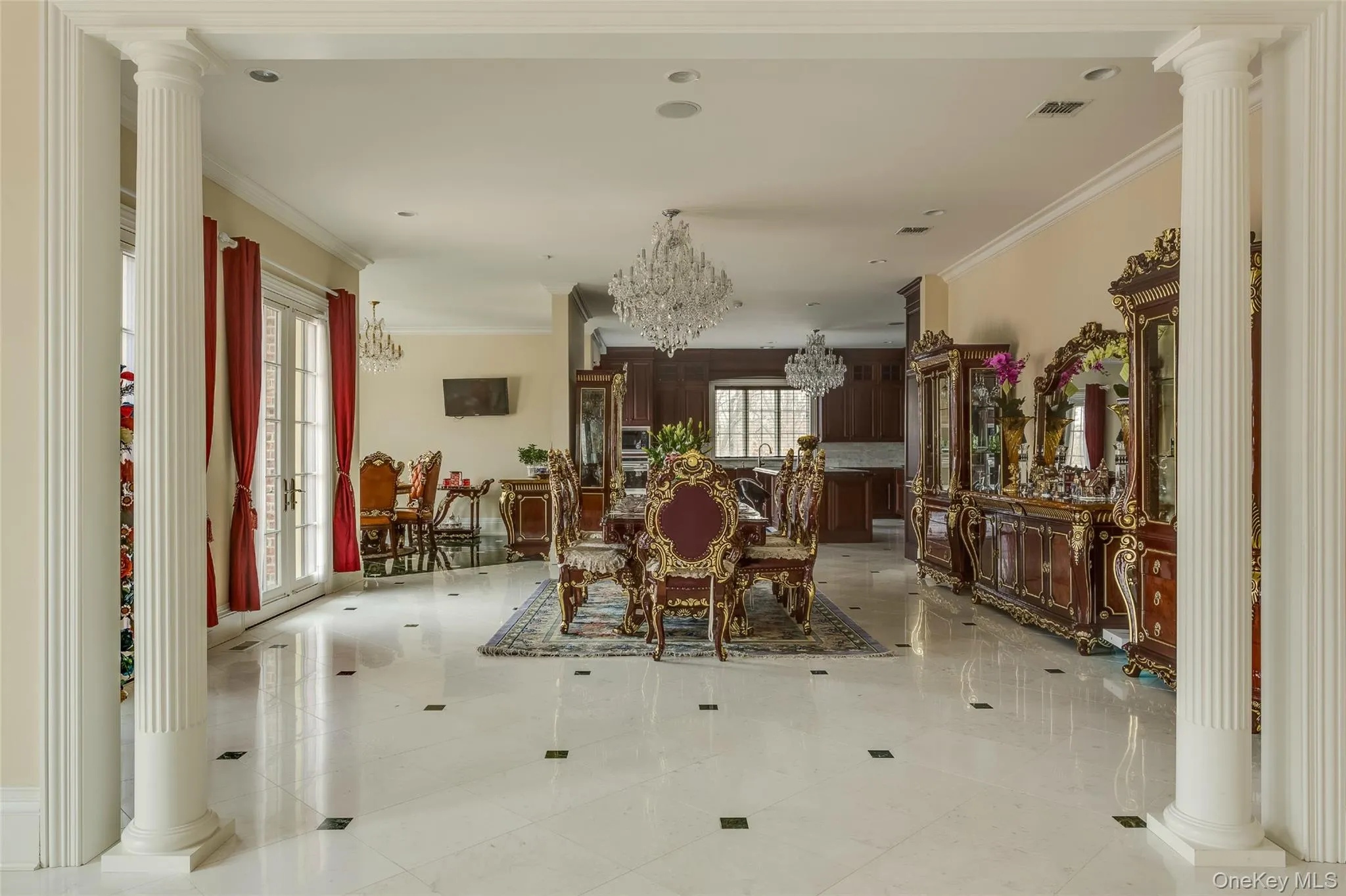 Dining area with decorative columns, a chandelier, ornamental molding, and recessed lighting Dining area with decorative columns, a chandelier, ornamental molding, and recessed lighting