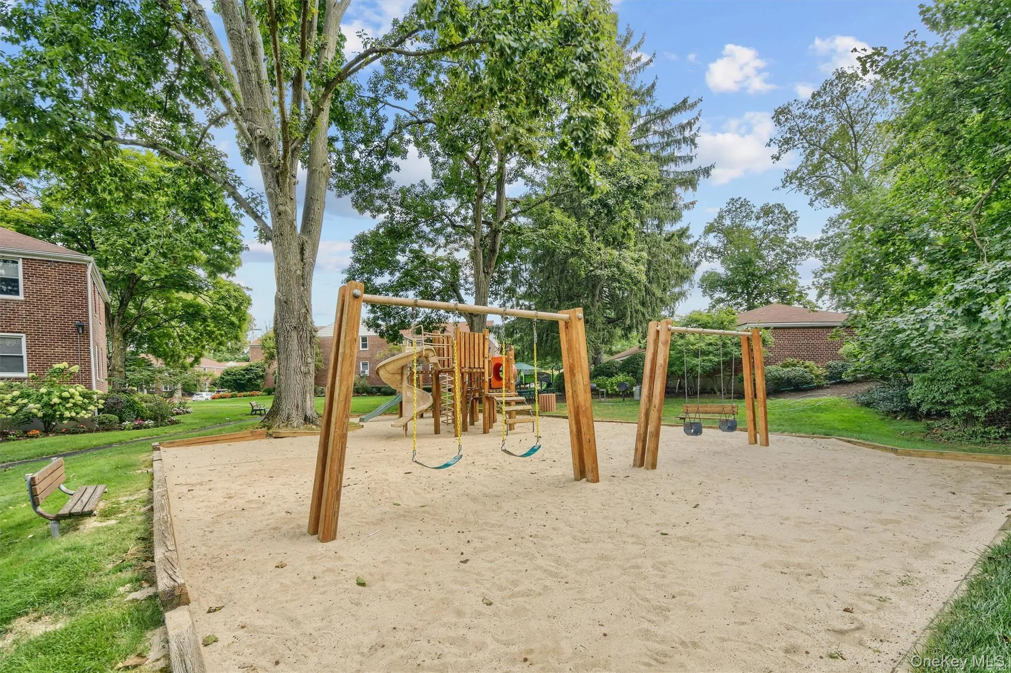 Community play area with a yard Community play area with a yard
