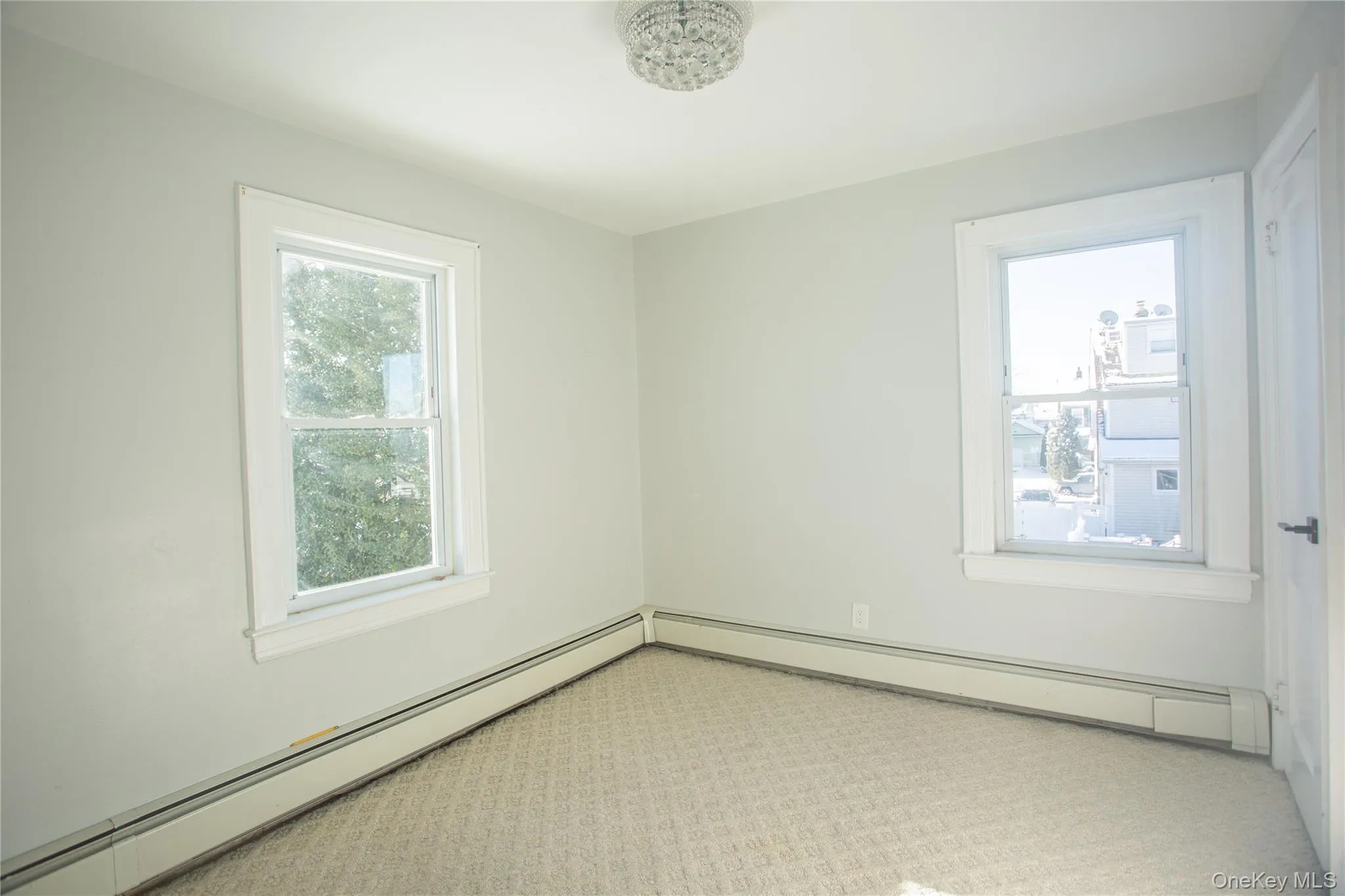 Unfurnished room with baseboard heating Unfurnished room with baseboard heating