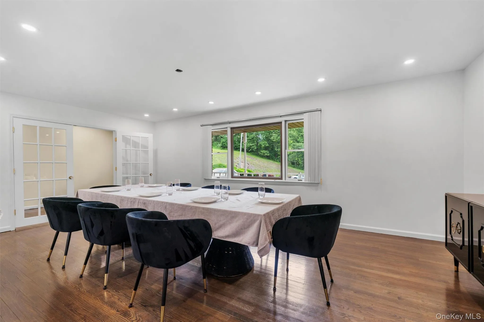 Dining room featuring french doors, dark wood-style floors, and recessed lighting Dining room featuring french doors, dark wood-style floors, and recessed lighting