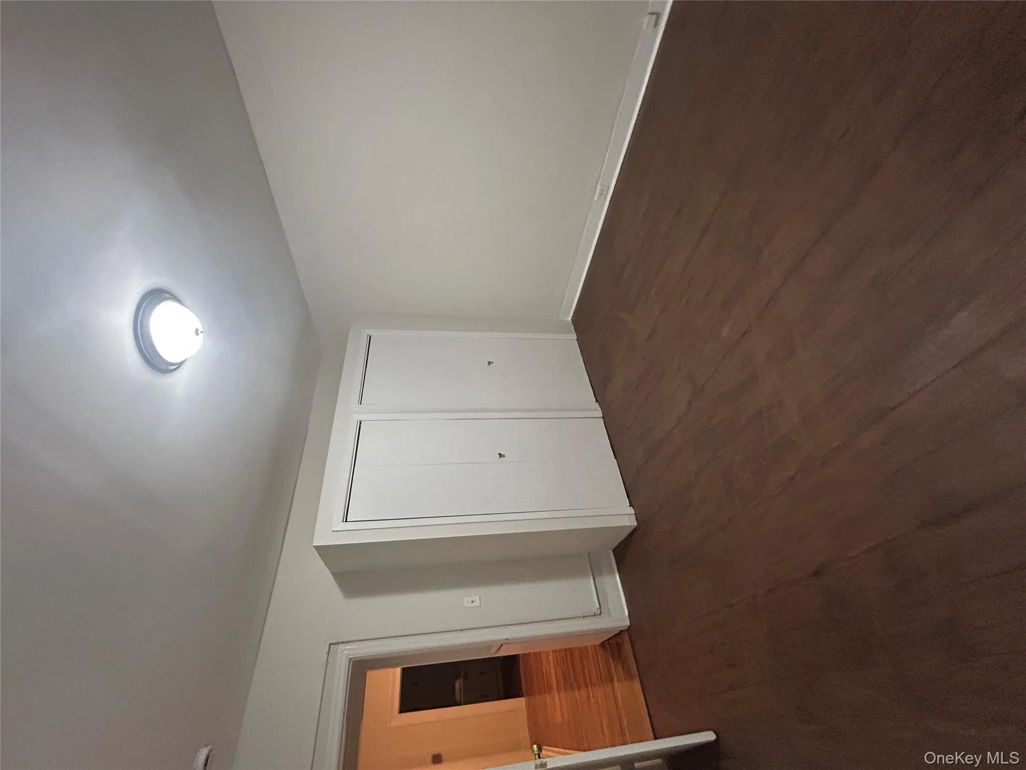 Unfurnished bedroom featuring dark wood-type flooring Unfurnished bedroom featuring dark wood-type flooring