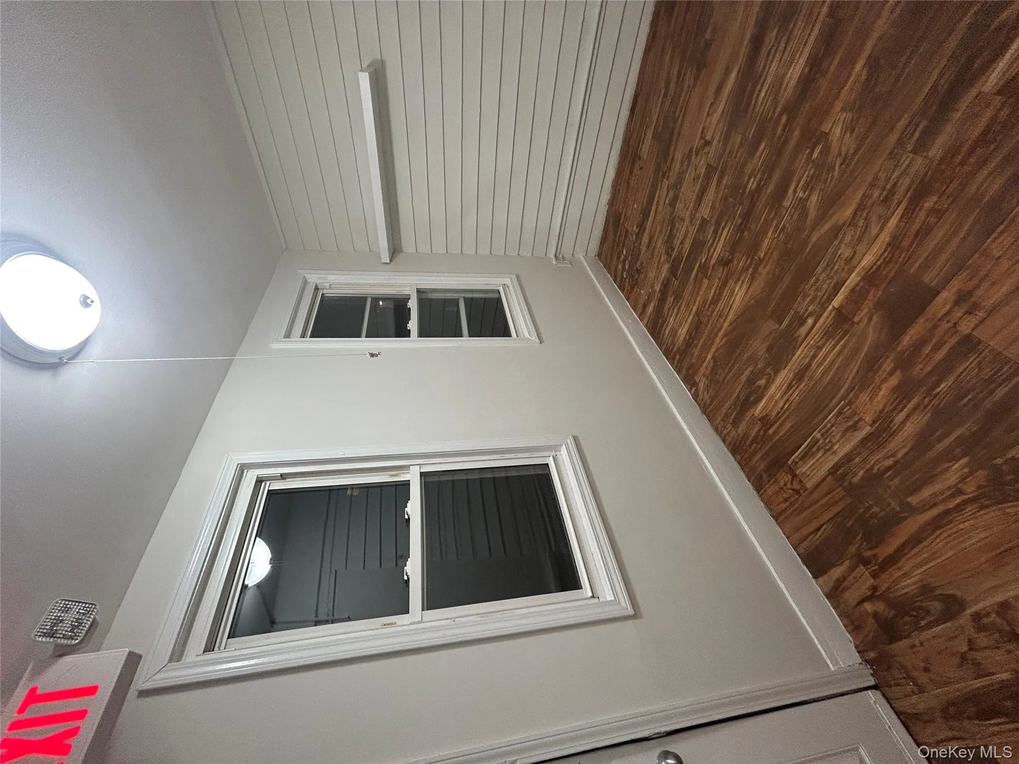 Empty room featuring dark wood-style flooring Empty room featuring dark wood-style flooring