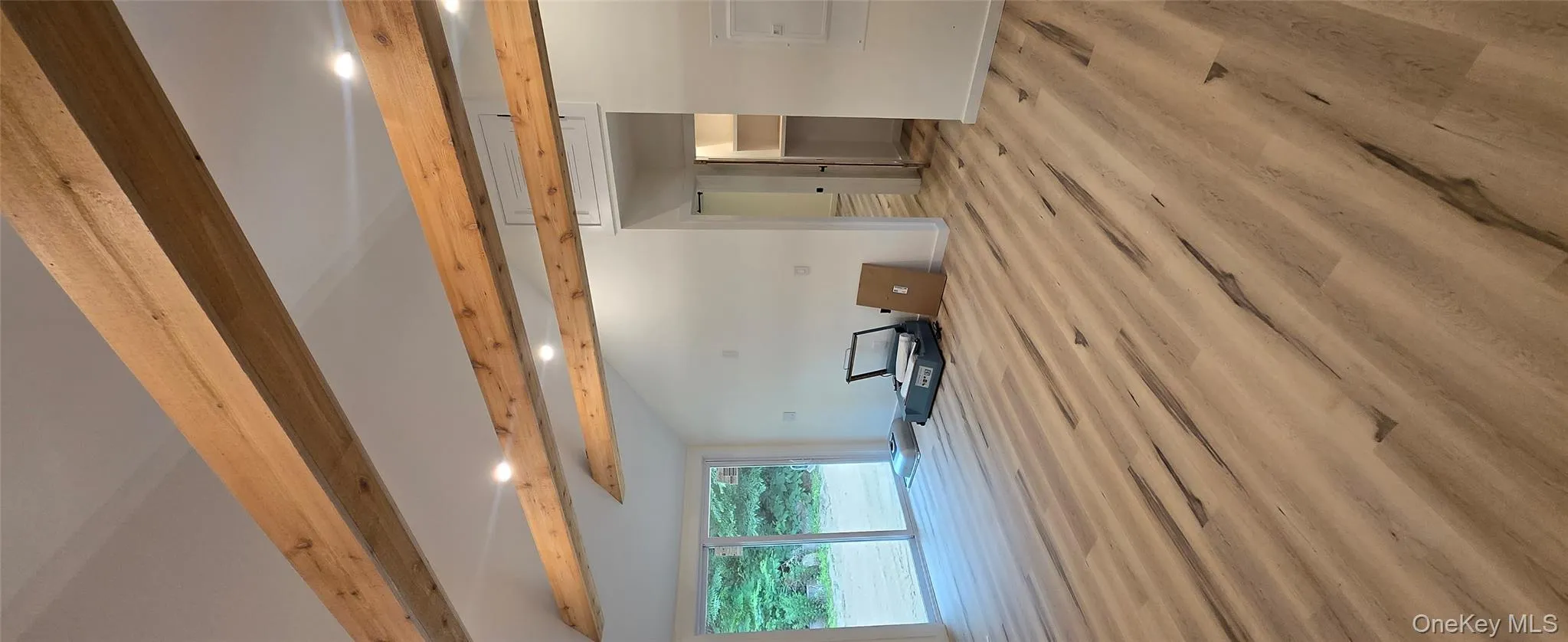 Unfurnished living room with recessed lighting and wood finished floors Unfurnished living room with recessed lighting and wood finished floors