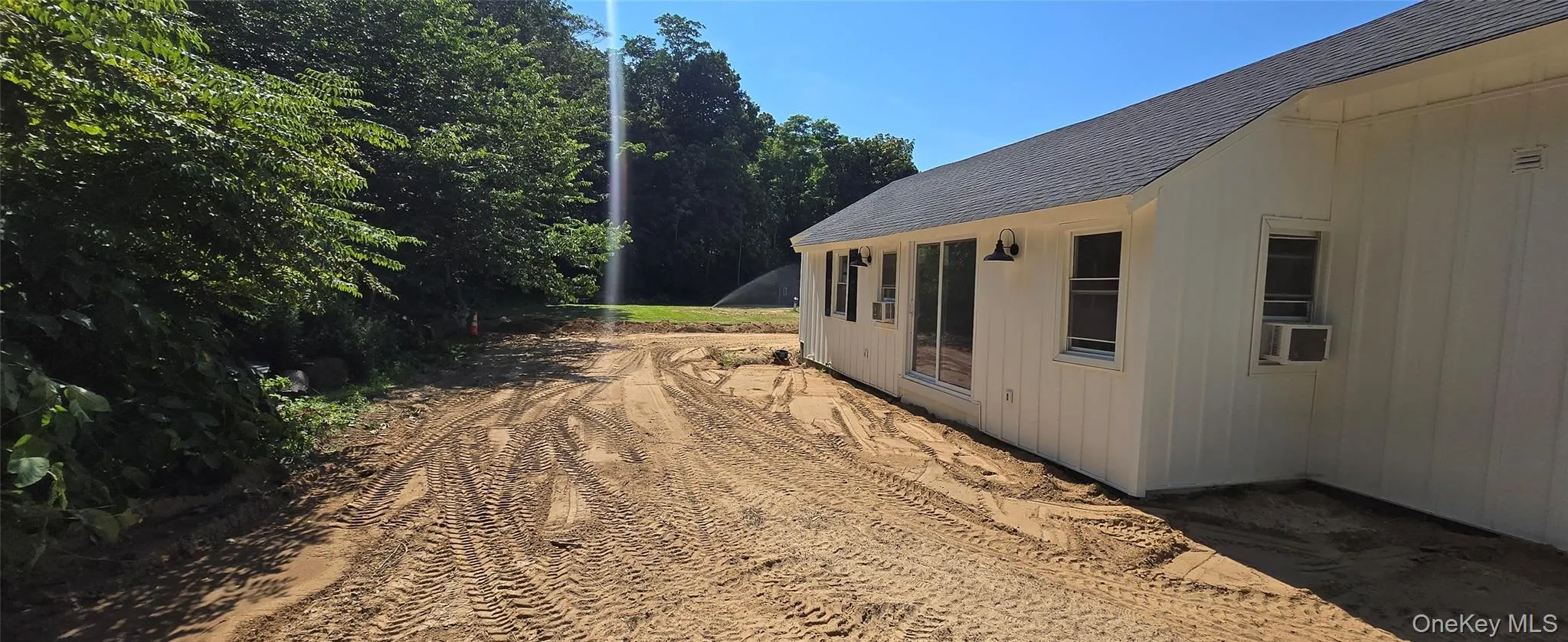 View of property exterior featuring a shingled roof View of property exterior featuring a shingled roof