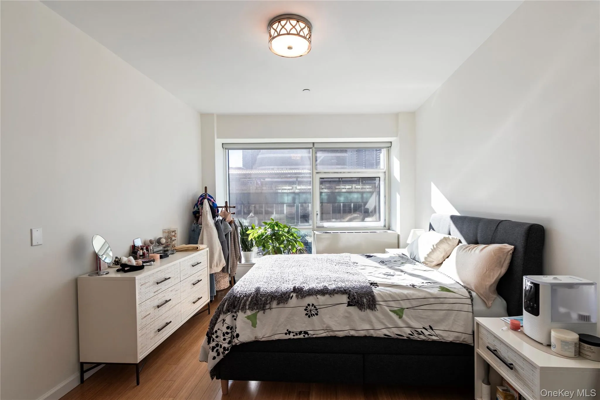 Bedroom featuring wood finished floors Bedroom featuring wood finished floors