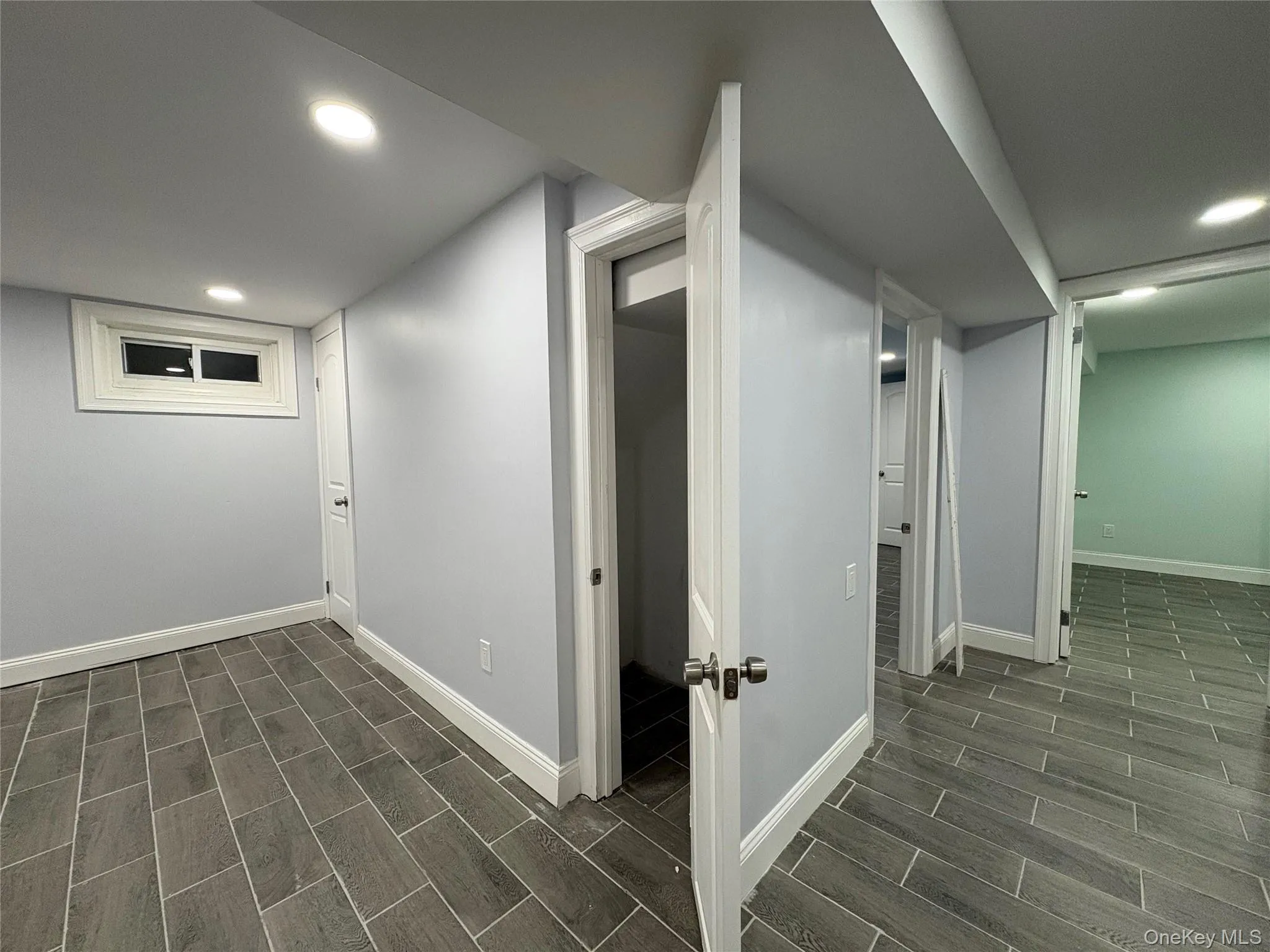 Finished below grade area with recessed lighting and wood tiled floors Finished below grade area with recessed lighting and wood tiled floors