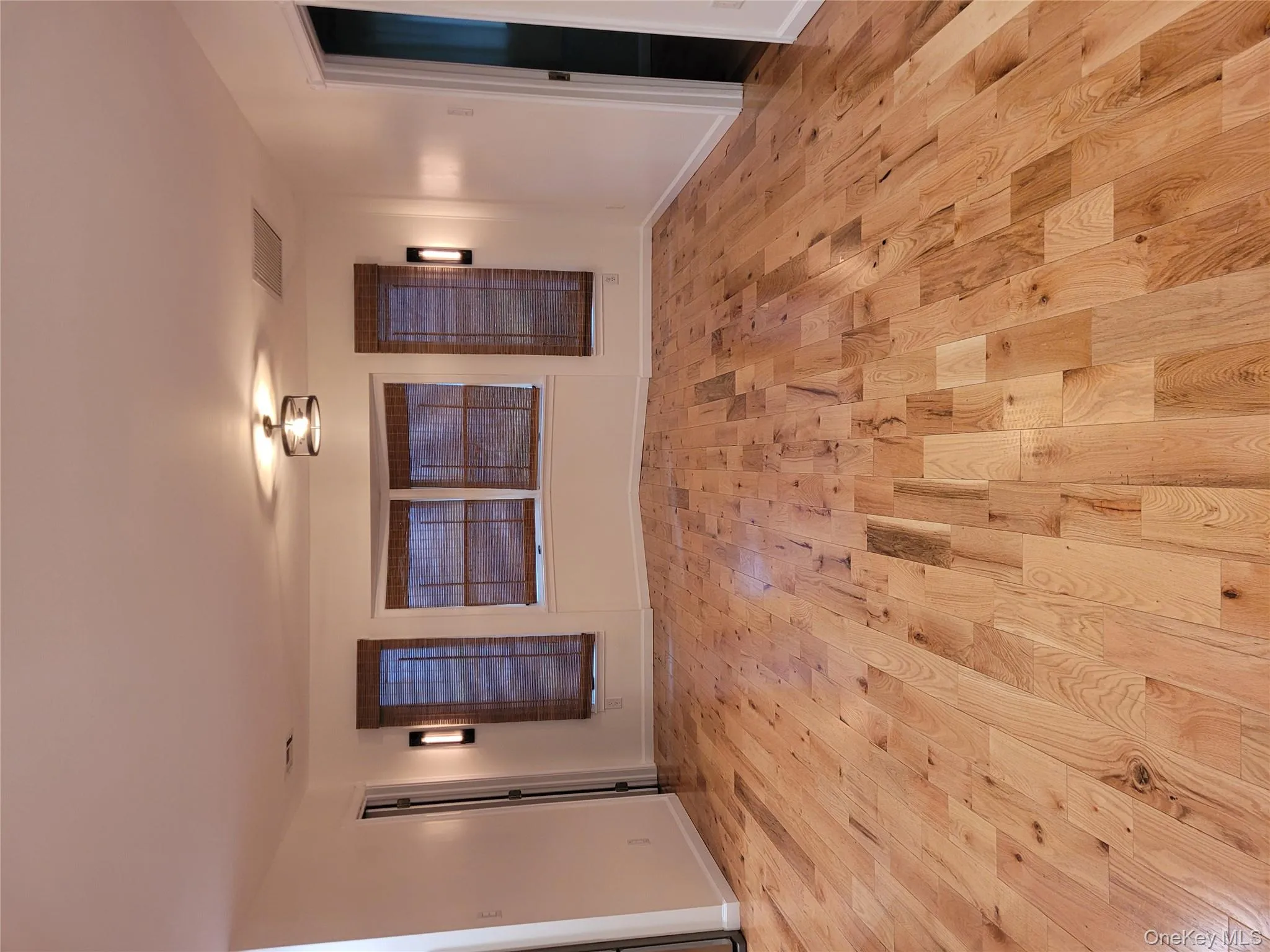 Empty room featuring light wood-style flooring and baseboards Empty room featuring light wood-style flooring and baseboards