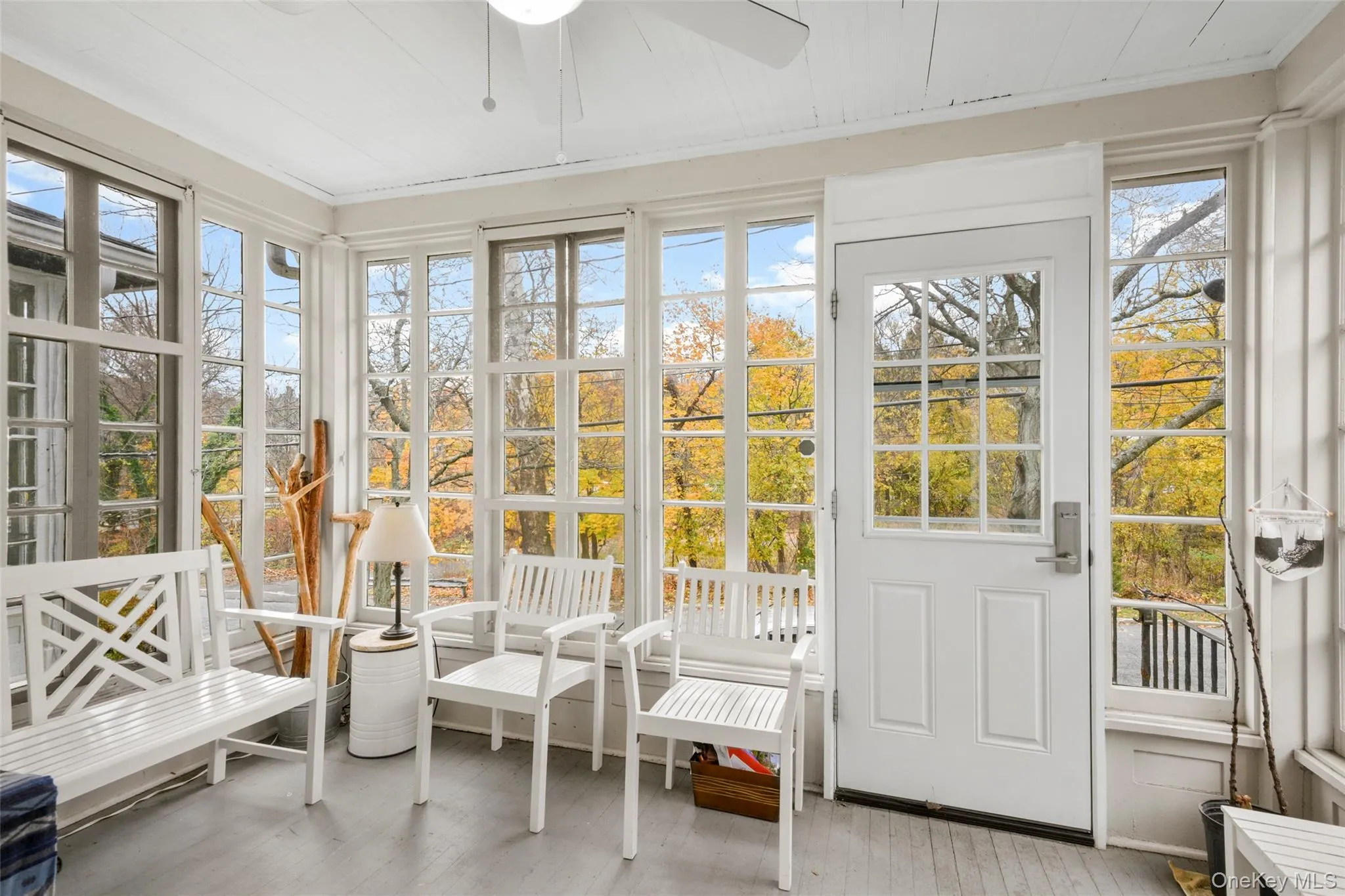 Sunroom / solarium featuring ceiling fan Sunroom / solarium featuring ceiling fan