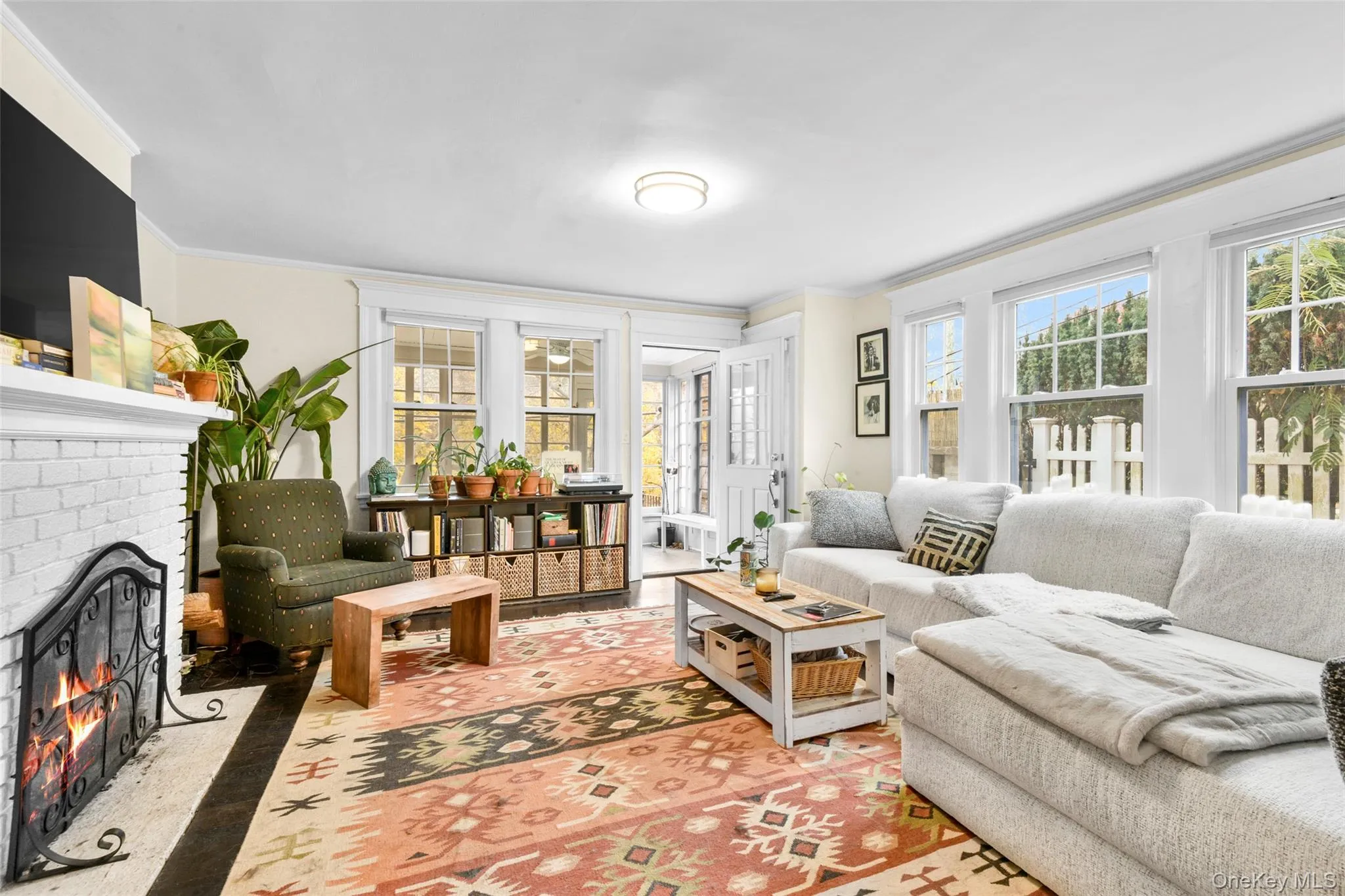 Living area with a fireplace and crown molding Living area with a fireplace and crown molding