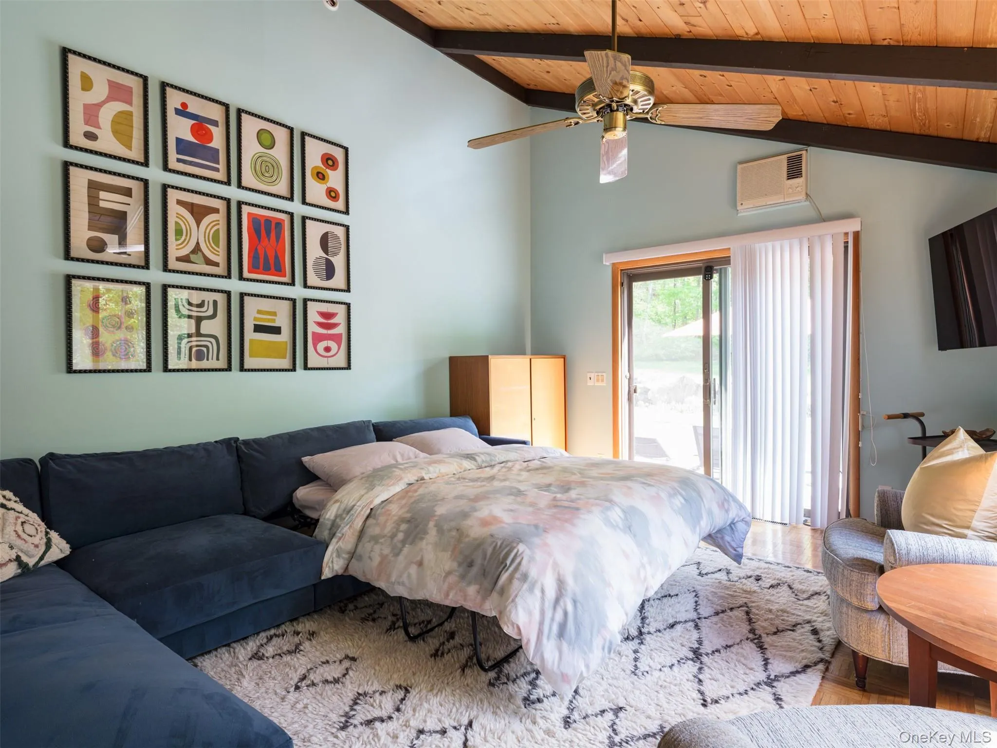 Bedroom featuring wood ceiling, access to outside, and ceiling fan Bedroom featuring wood ceiling, access to outside, and ceiling fan