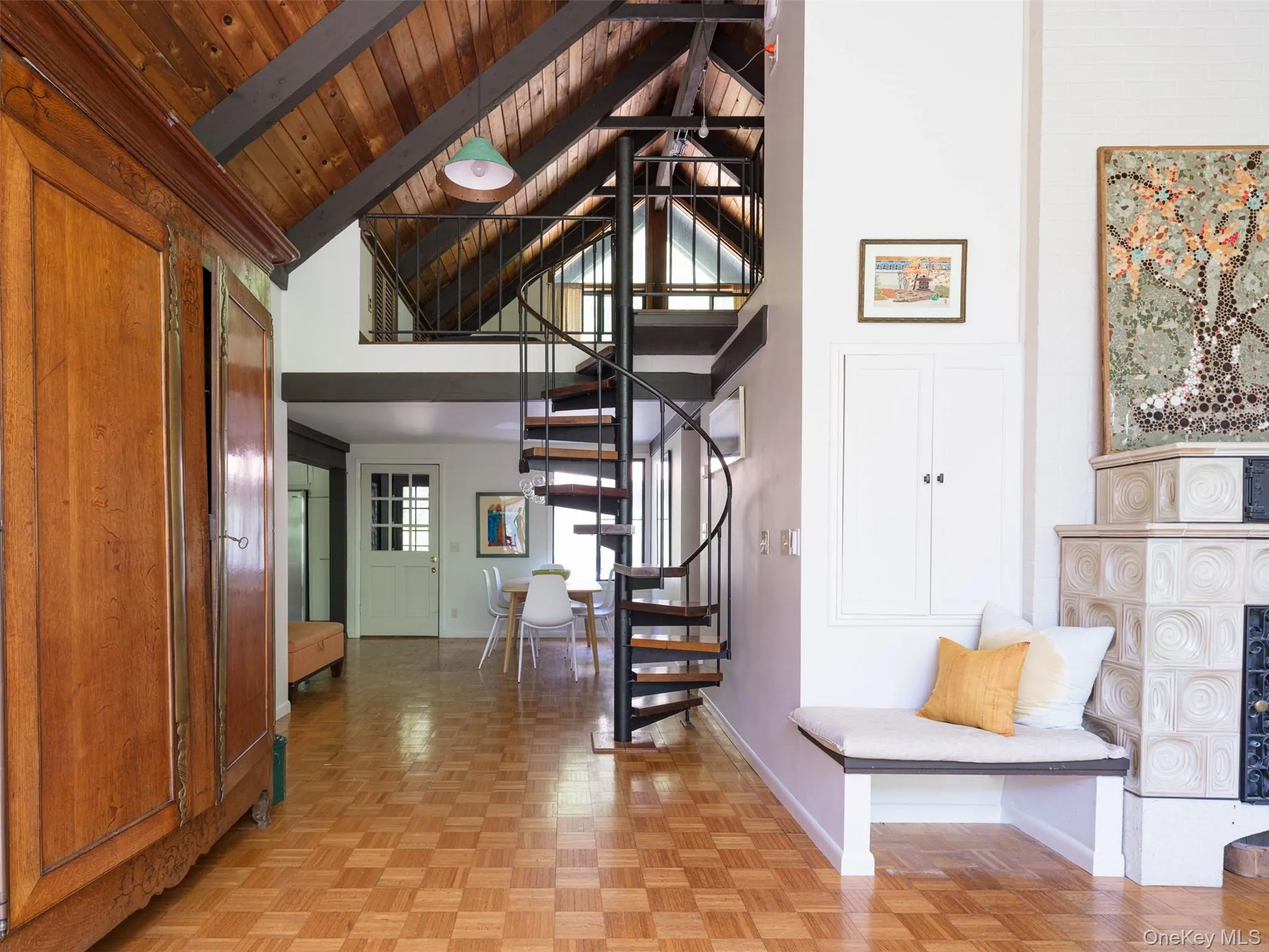 Stairway featuring a wood ceiling with exposed beams and high vaulted ceiling Stairway featuring a wood ceiling with exposed beams and high vaulted ceiling