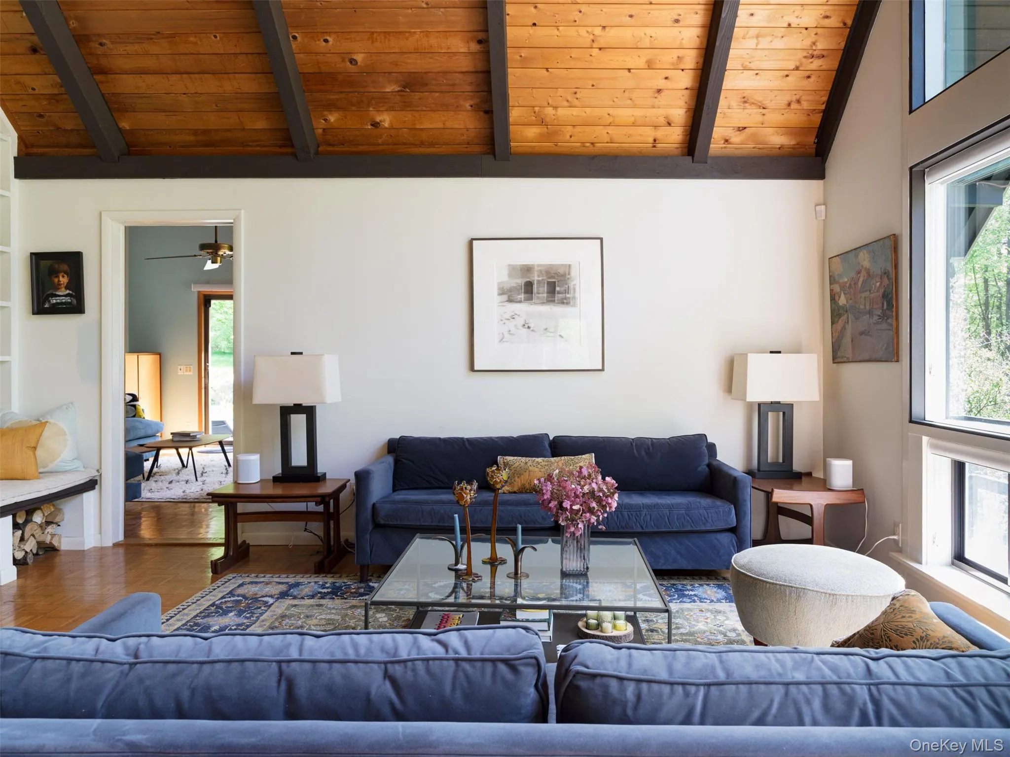 Living area featuring wooden ceiling and wood finished floors Living area featuring wooden ceiling and wood finished floors