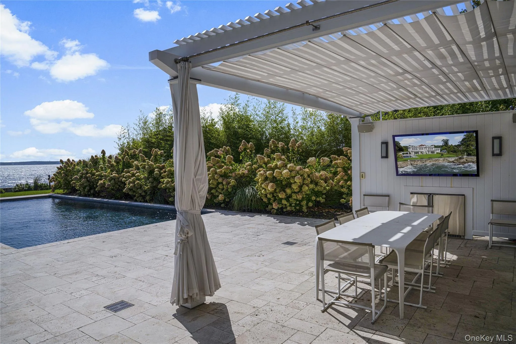 View of patio / terrace featuring a pergola, outdoor dining area, and an outdoor pool View of patio / terrace featuring a pergola, outdoor dining area, and an outdoor pool