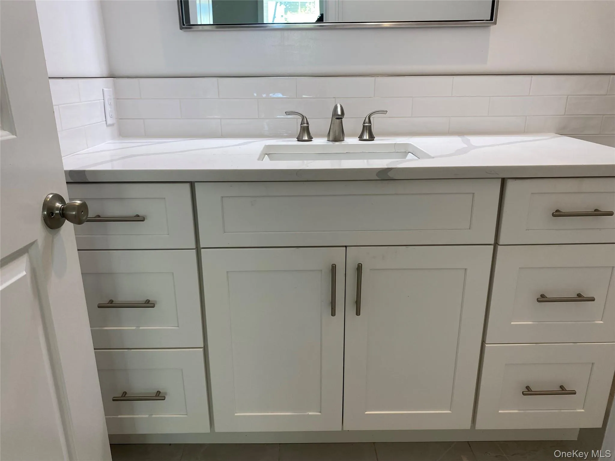 Bathroom featuring vanity and tile patterned flooring Bathroom featuring vanity and tile patterned flooring