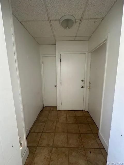 Hallway with a drop ceiling Hallway with a drop ceiling