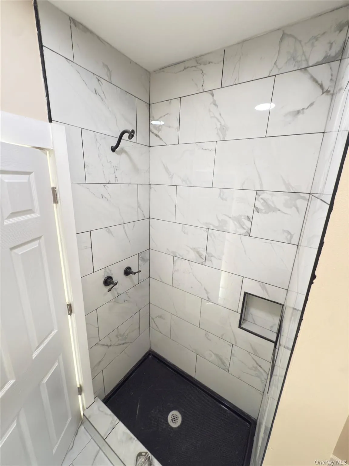 Bathroom featuring a stall shower Bathroom featuring a stall shower