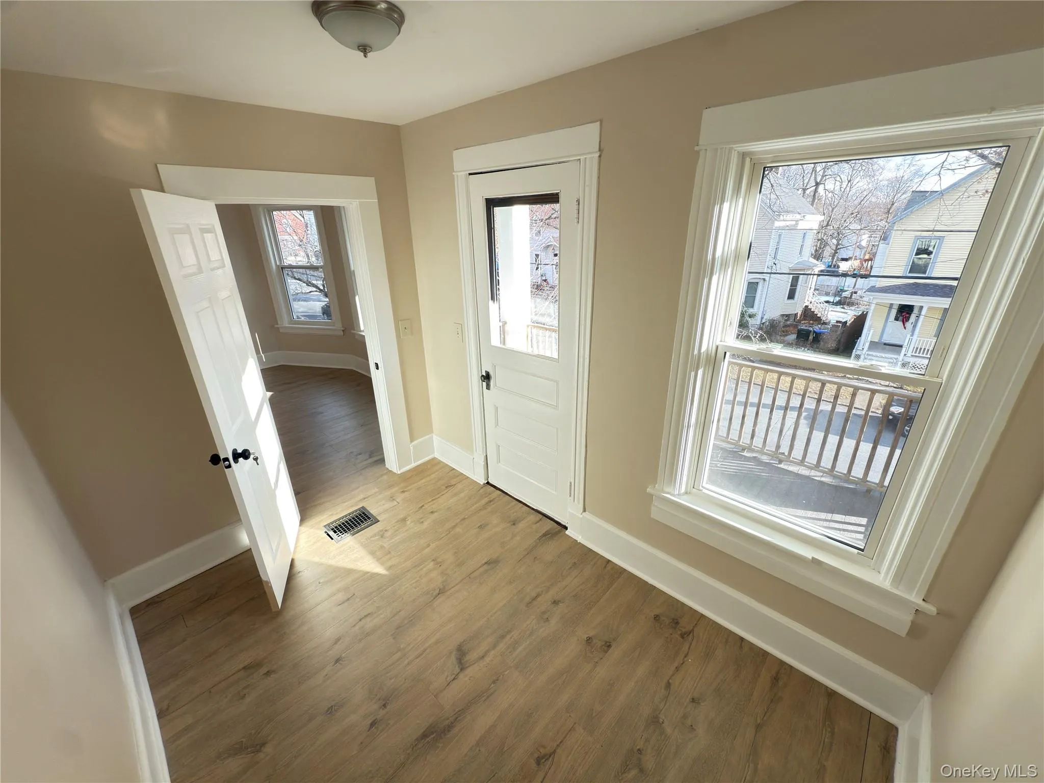 Entrance foyer featuring wood finished floors and baseboards Entrance foyer featuring wood finished floors and baseboards