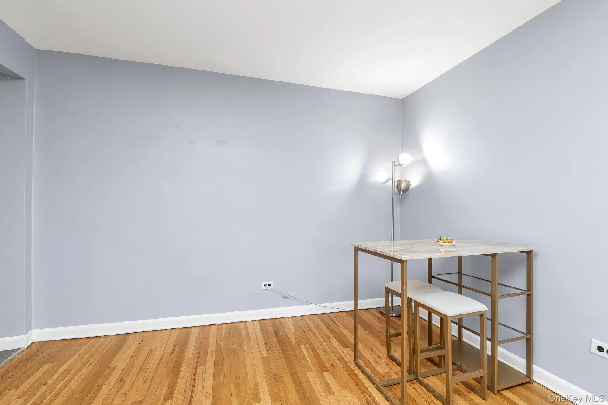 Unfurnished office with baseboards and light wood-style floors Unfurnished office with baseboards and light wood-style floors