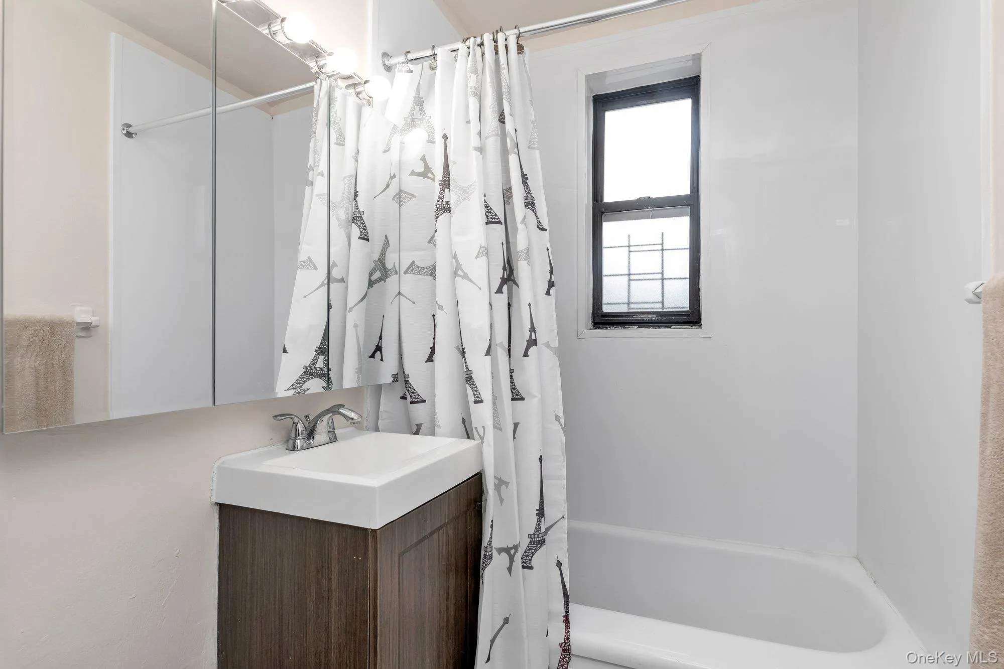 Bathroom with vanity and shower / bath combo with shower curtain Bathroom with vanity and shower / bath combo with shower curtain