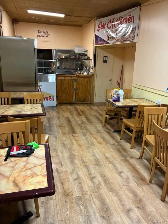 Kitchen with light wood-style flooring and wainscoting Kitchen with light wood-style flooring and wainscoting