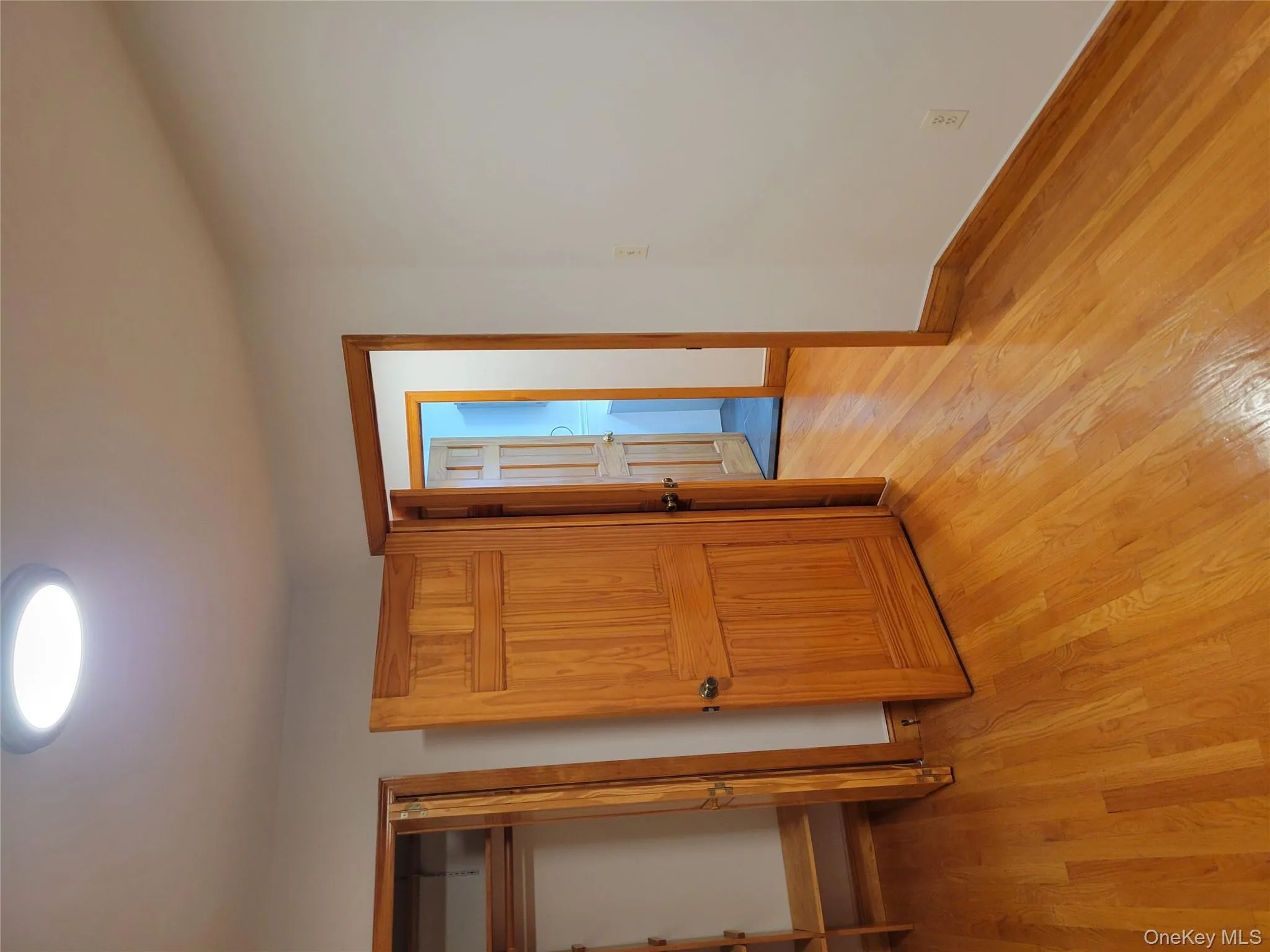 Unfurnished bedroom featuring light wood-style flooring and a closet Unfurnished bedroom featuring light wood-style flooring and a closet