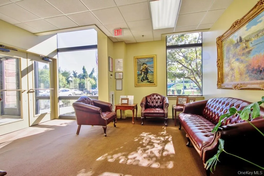 Common area featuring a drop ceiling Common area featuring a drop ceiling