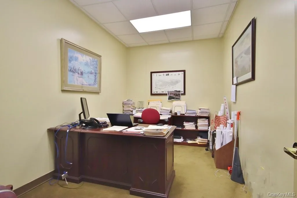 Office featuring a drop ceiling Office featuring a drop ceiling