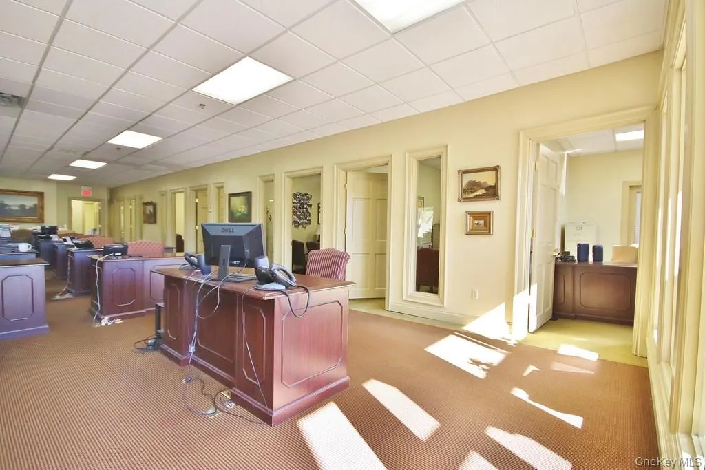 Office area featuring a paneled ceiling Office area featuring a paneled ceiling