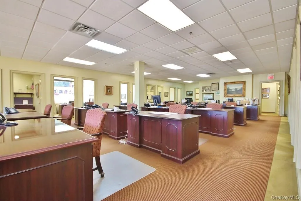 Office area featuring a drop ceiling Office area featuring a drop ceiling