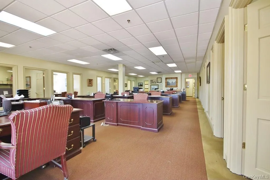 Home office with a paneled ceiling Home office with a paneled ceiling