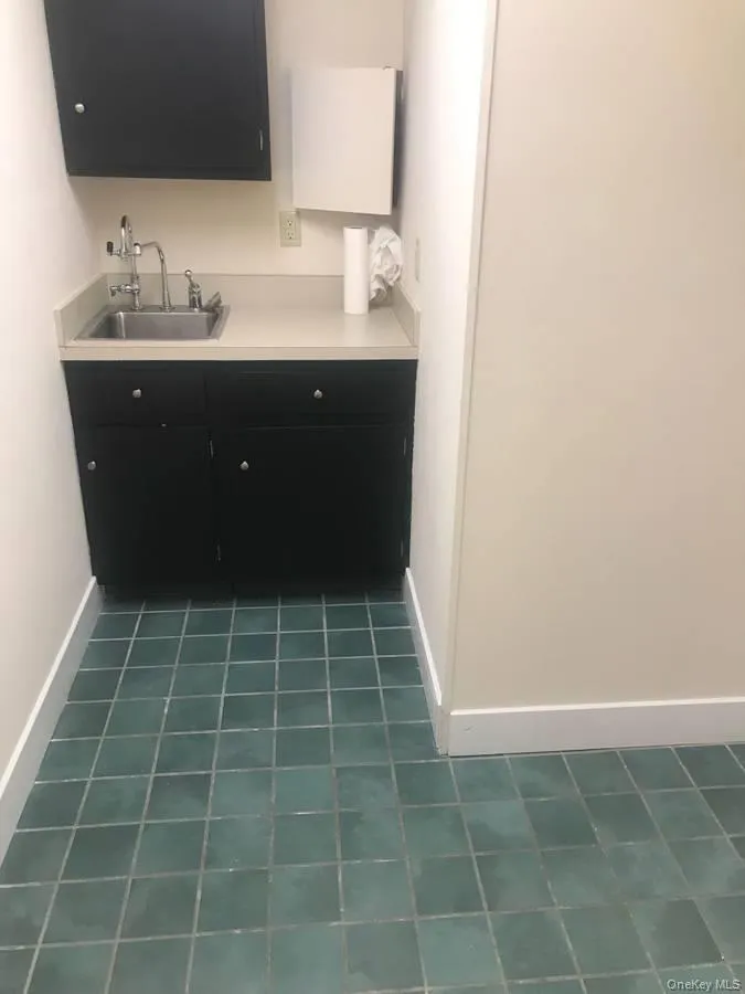 Bathroom with vanity and baseboards Bathroom with vanity and baseboards