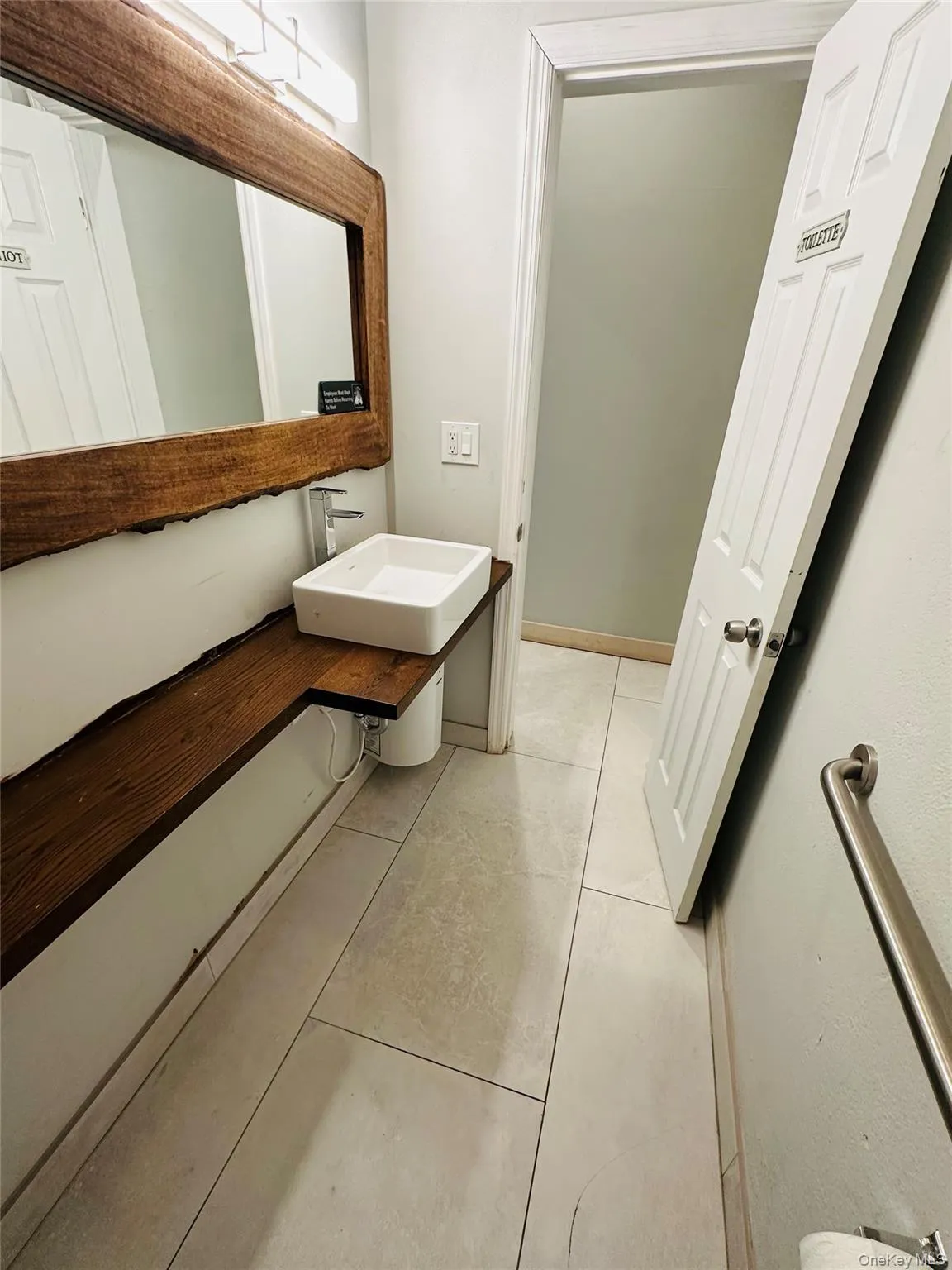 Bathroom with custom hardwood vanity. Bathroom with custom hardwood vanity.