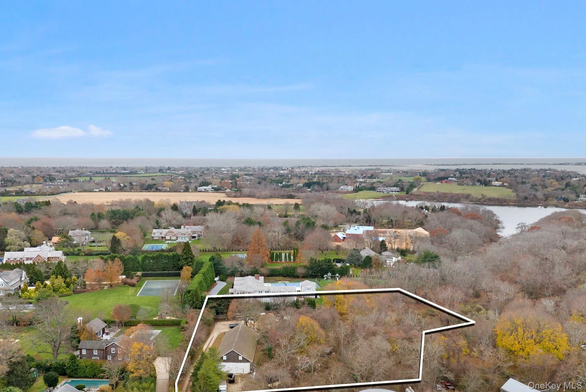 View of property location featuring property boundaries highlighted and a nearby body of water View of property location featuring property boundaries highlighted and a nearby body of water
