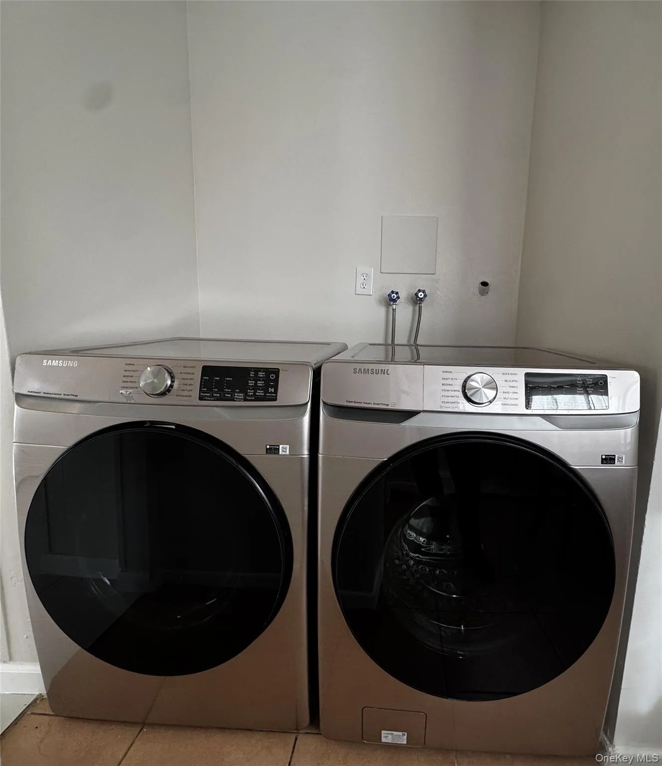 Laundry area with a washing machine and dryer Laundry area with a washing machine and dryer