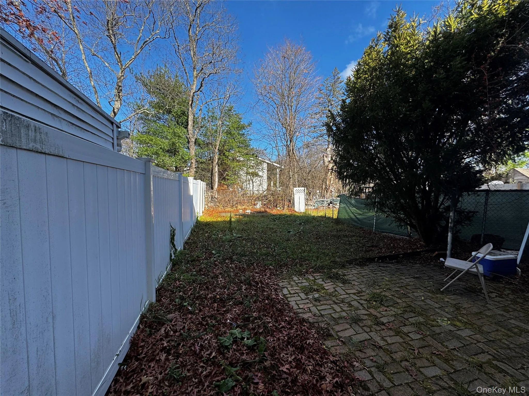 View of yard with a patio area View of yard with a patio area