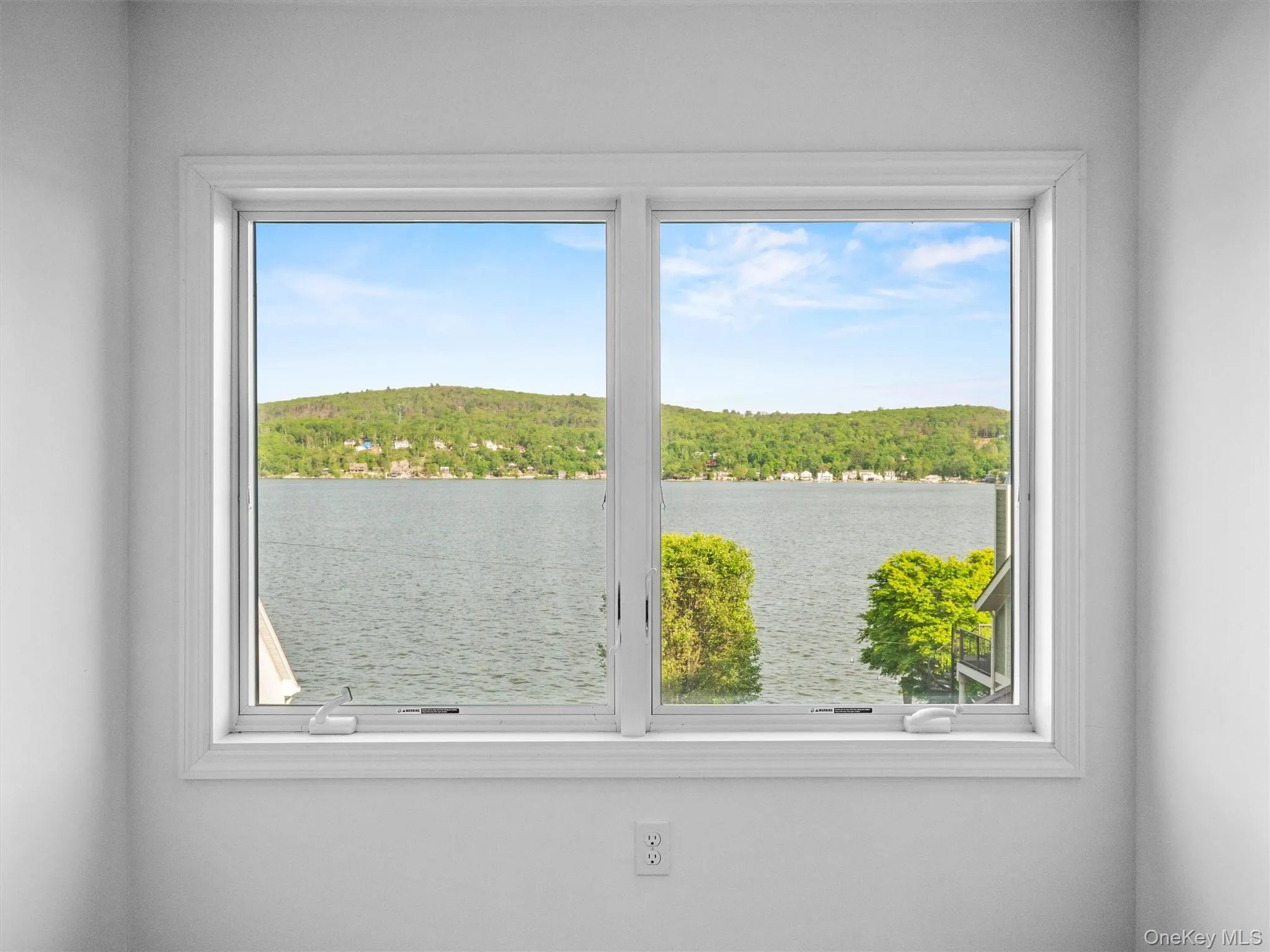 Water view with a heavily wooded area Water view with a heavily wooded area